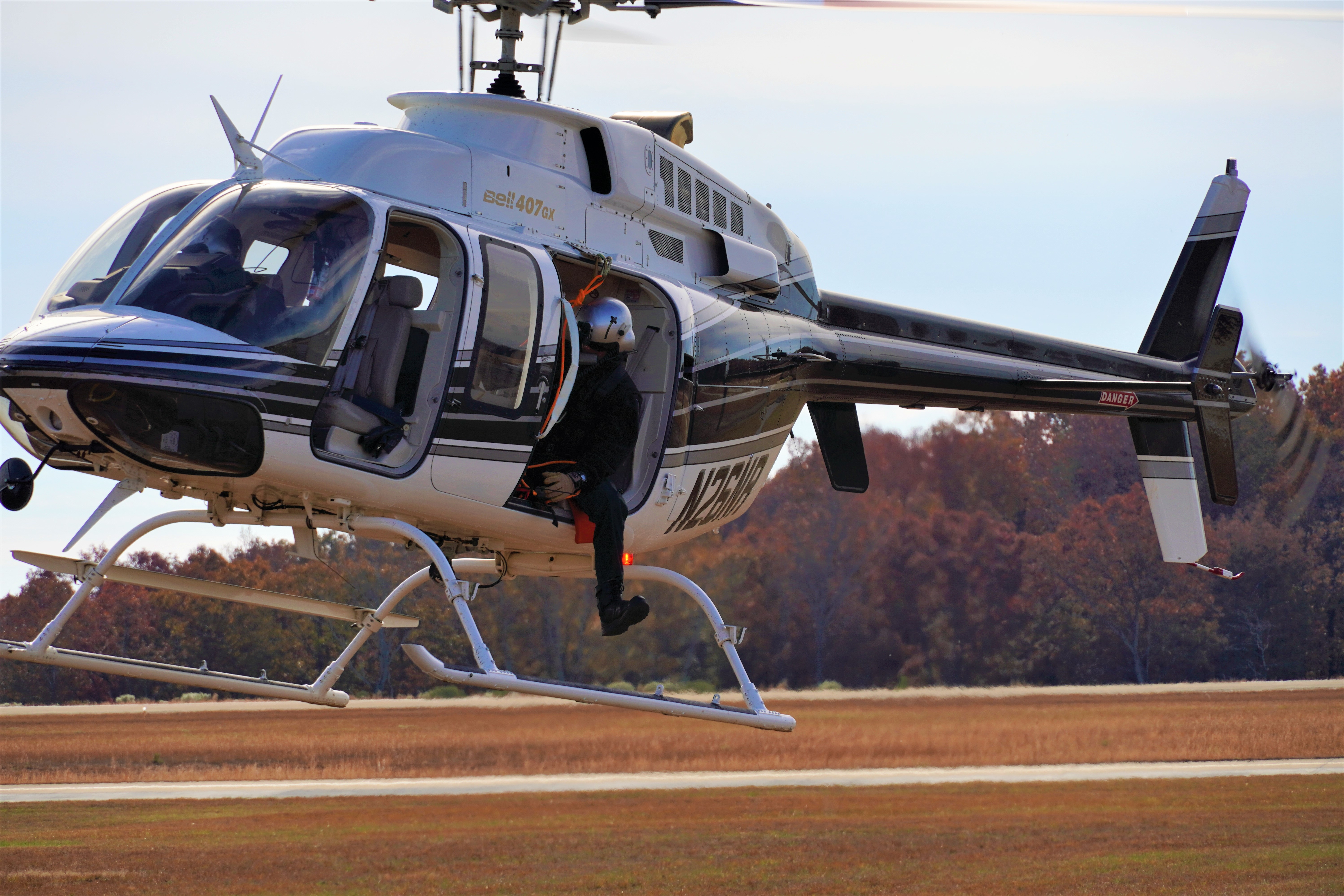 Helicopter with aerial observer landing