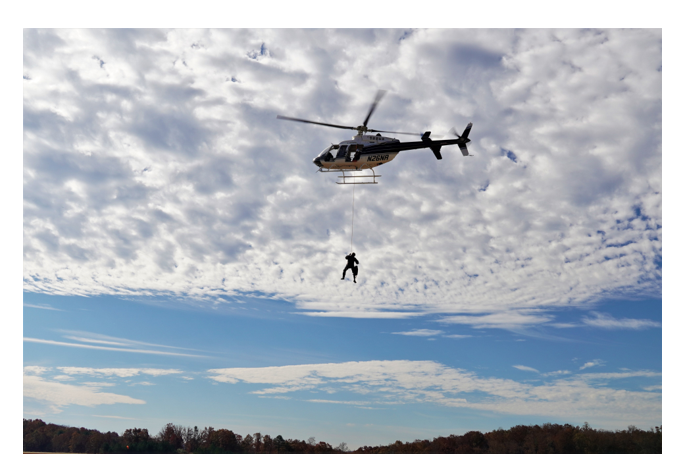 Helicopter with rappeler below