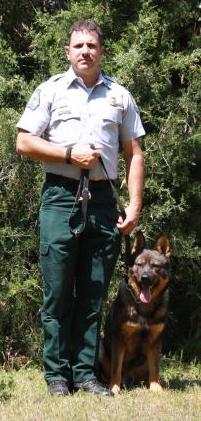 Picture of Warden Bob Holley with his K9 Creek