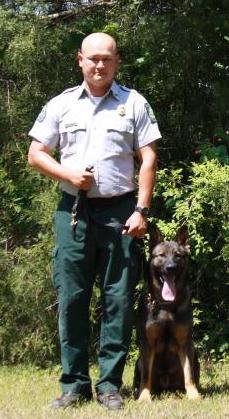 Picture of Warden Eric Isom with his K9 Colt